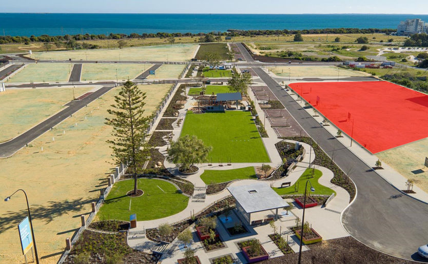 Aerial drone shot of Shoreline Precinct highlighted of M/31 Apartments and M/31 Terrace Homes site overlooking the ocean and adjacent to the parkland