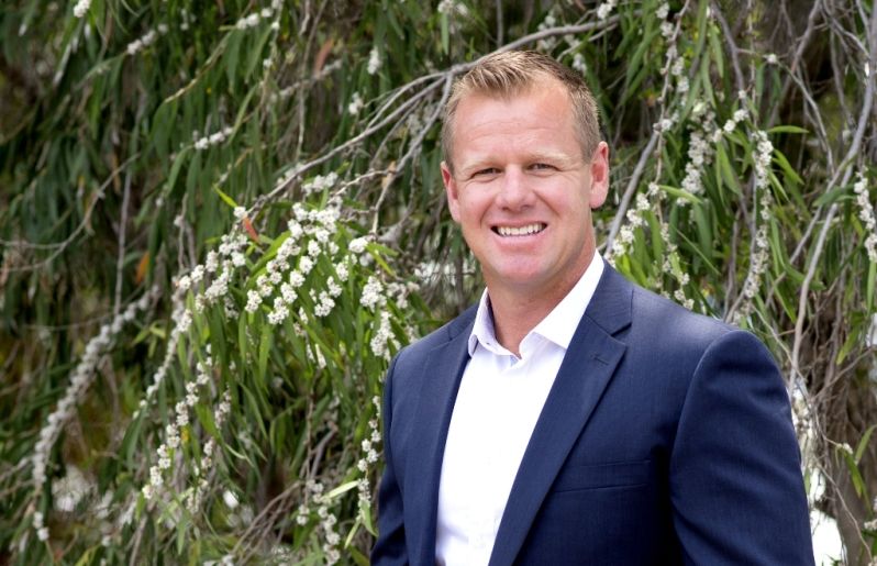 Portrait shot of John (Johnno) Wroth Director of M/Group land division, Monument, in front of nature trees