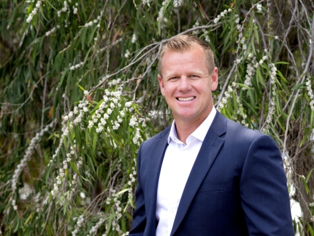 Portrait shot of John (Johnno) Wroth Director of M/Group land division, Monument, in front of nature trees
